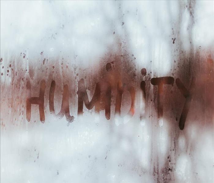 Humidity spelt on a wet window